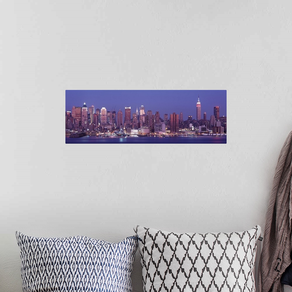 A bohemian room featuring Panoramic photograph of skyline and waterfront at night with buildings lit up and lights reflecte...