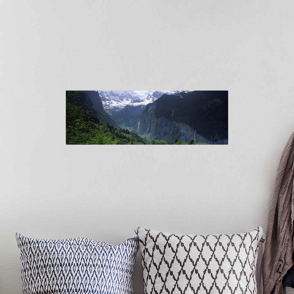 A bohemian room featuring Waterfalls in a forest Lauterbrunnen Valley Wengen Bernese Oberland Berne Canton Switzerland
