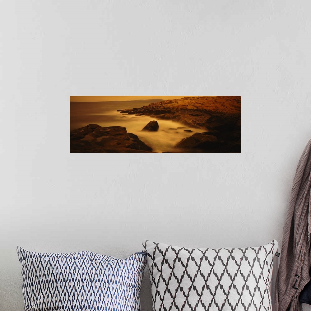 A bohemian room featuring Large photograph of misty waters surrounding rocks in the Acadia National Park on the Schoodic Pe...