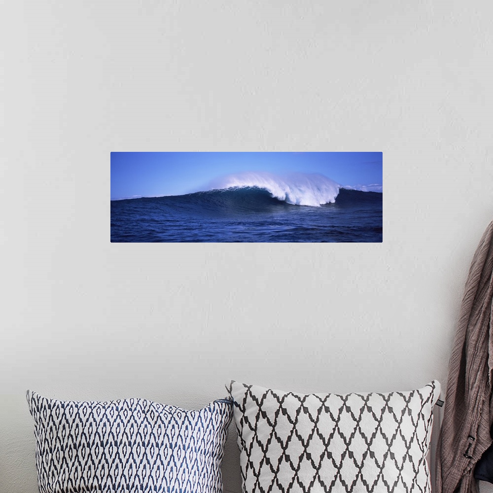 A bohemian room featuring Long canvas photo of a big wave crashing in the ocean.