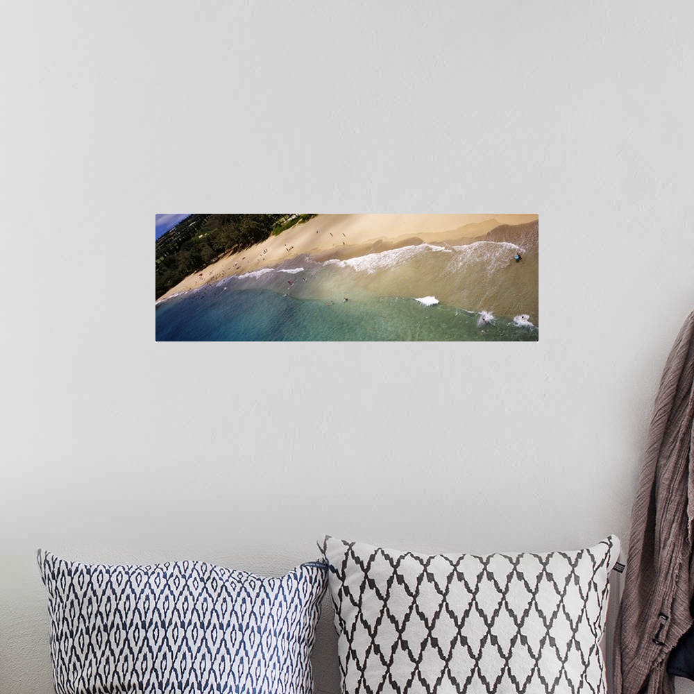 A bohemian room featuring Long photo on canvas of ocean waves crashing on the shore of a Hawaiian beach.