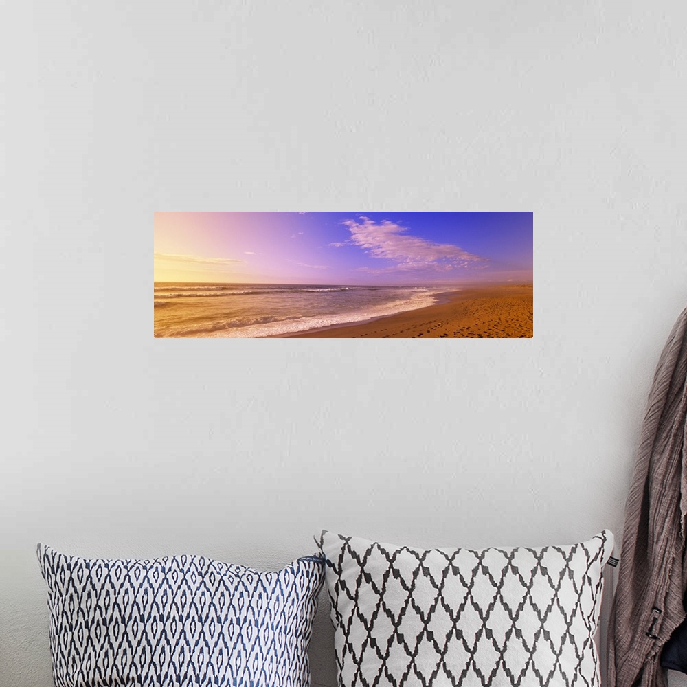 A bohemian room featuring Oversized, landscape photograph of waves hitting the sands of North Beach, on Point Reyes Nationa...