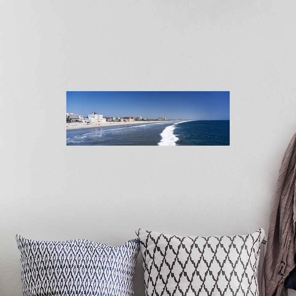 A bohemian room featuring Waves on the beach with buildings in the background, Santa Monica Beach, Santa Monica, California