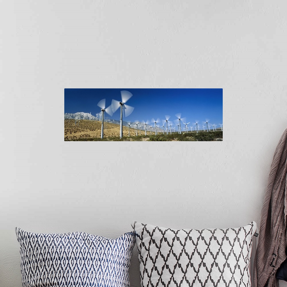 A bohemian room featuring Wind turbines spinning in a field, Palm Springs, California