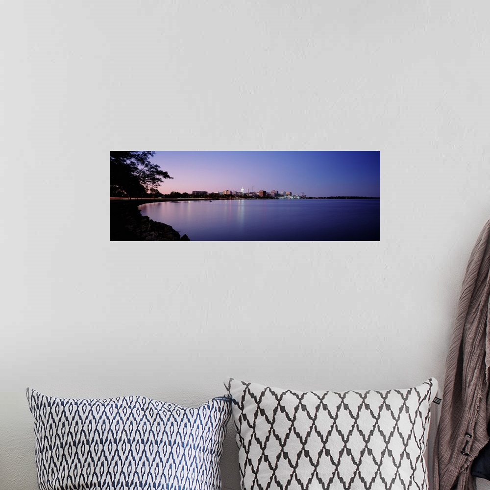A bohemian room featuring Panoramic photo print of buildings in Madison on the waterfront lit up at dusk.