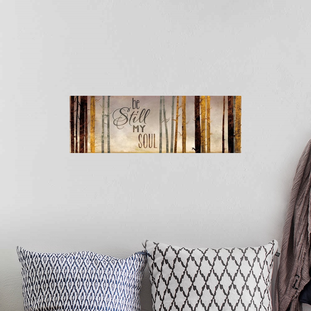 A bohemian room featuring Contemporary artwork of a forest with the words "Be still my soul."