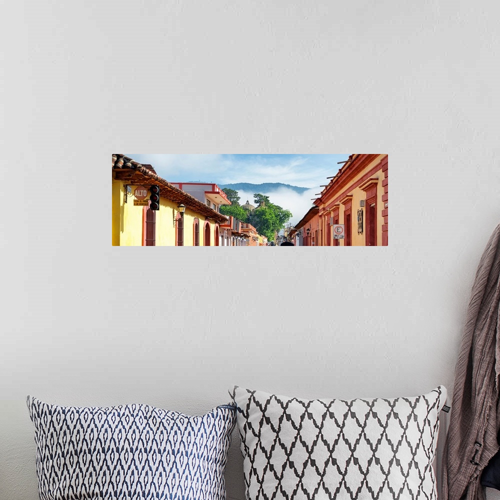 A bohemian room featuring Panoramic photograph of a streetscape at San Cristobal de Las Casas in Chiapas, Mexico, with heav...