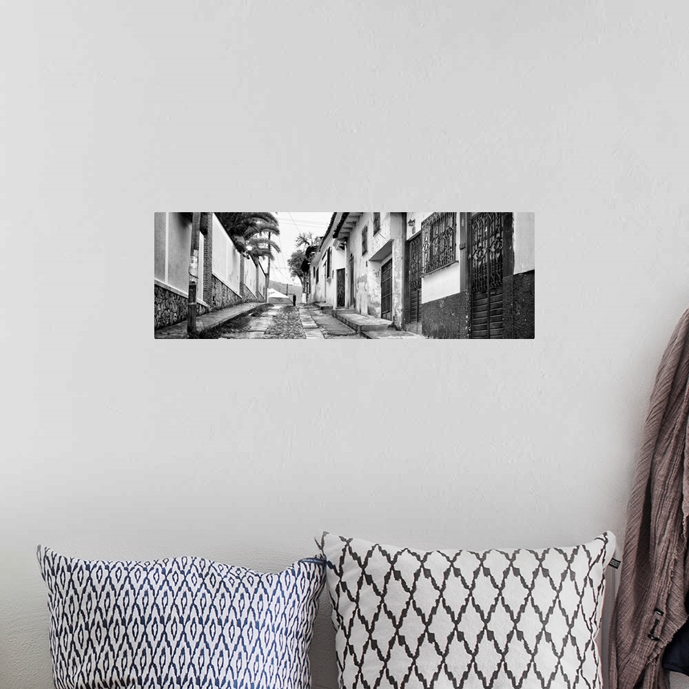 A bohemian room featuring Black and white panoramic photograph of a streetscape at San Cristobal de Las Casas in Chiapas, M...