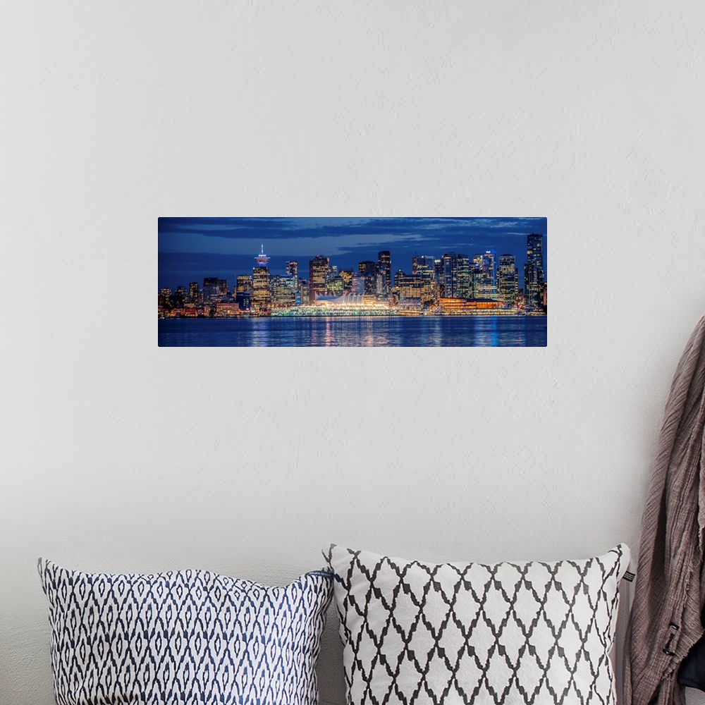 A bohemian room featuring Panorama of Vancouver skyline at night in British Columbia, Canada.