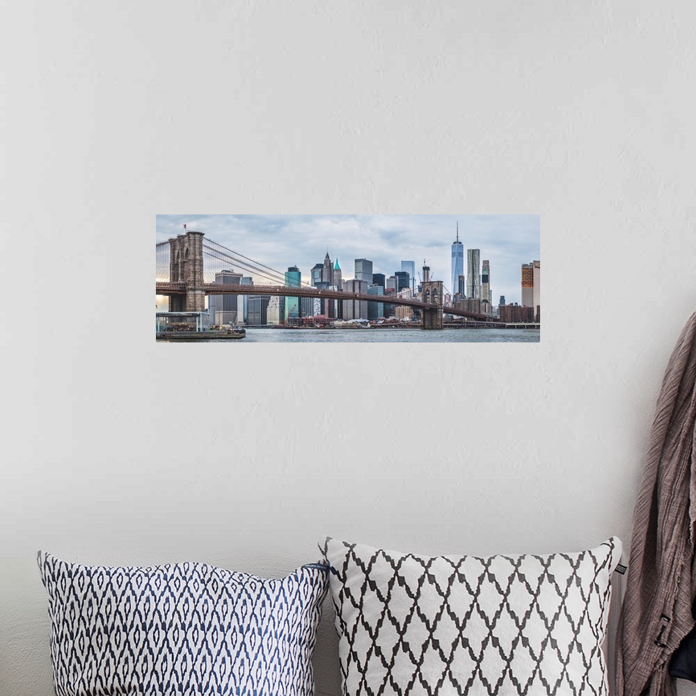 A bohemian room featuring Panoramic view of New York city skyline with the Brooklyn Bridge.
