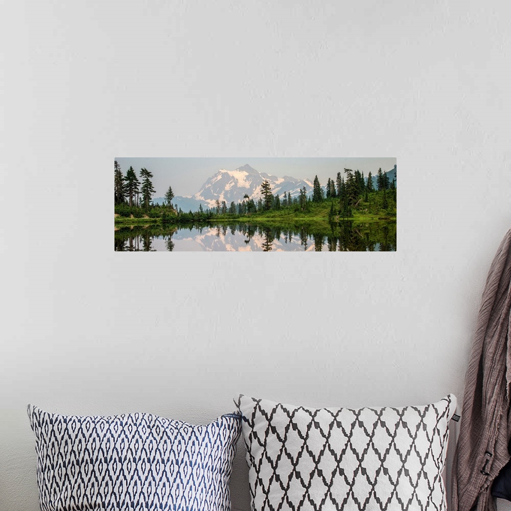 A bohemian room featuring Mount Shuksan is reflected in Picture Lake near Mount Shuksan, Washington.