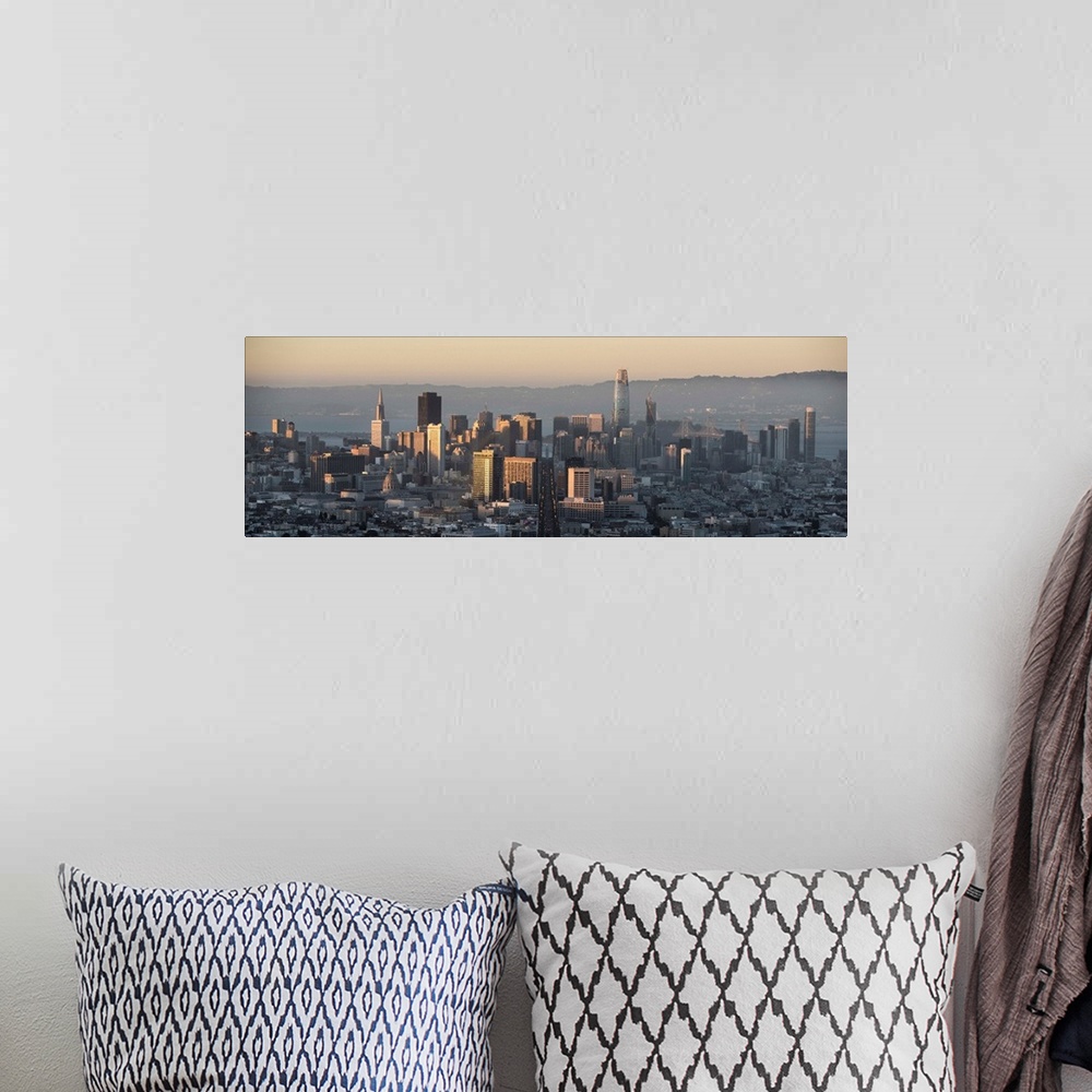 A bohemian room featuring Panoramic photograph of the San Francisco skyline close to sunset.