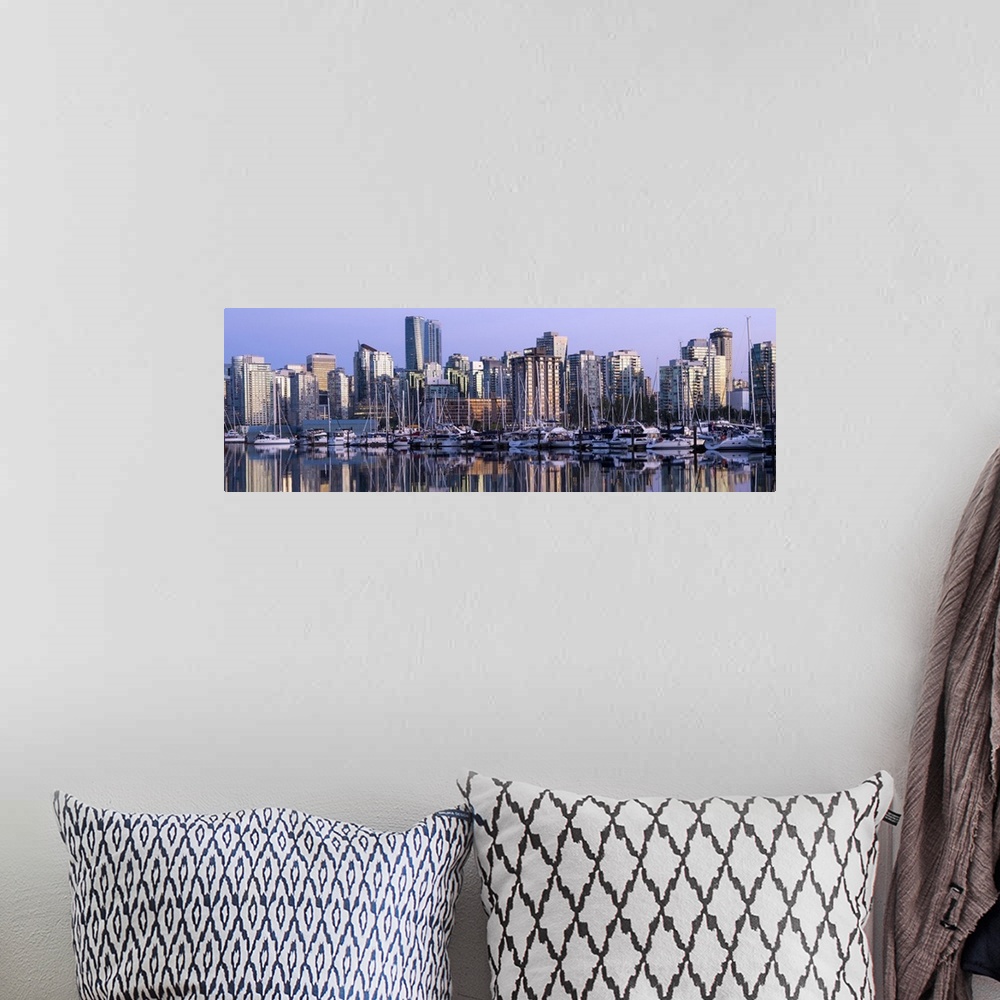 A bohemian room featuring Panoramic photograph of a purple sunset over the Vancouver skyline and harbor reflecting onto the...