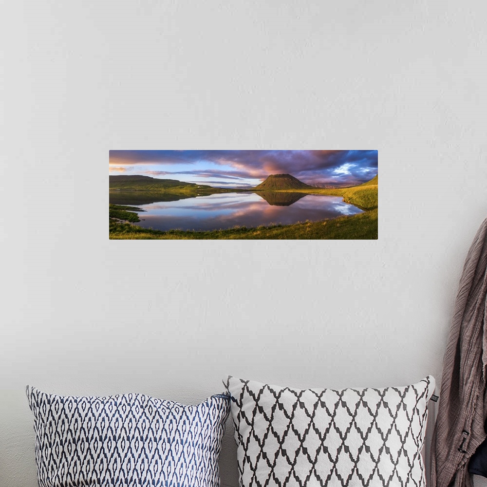 A bohemian room featuring Panoramic view of Mount Kirkjufell and the lake below at sunset, Iceland.