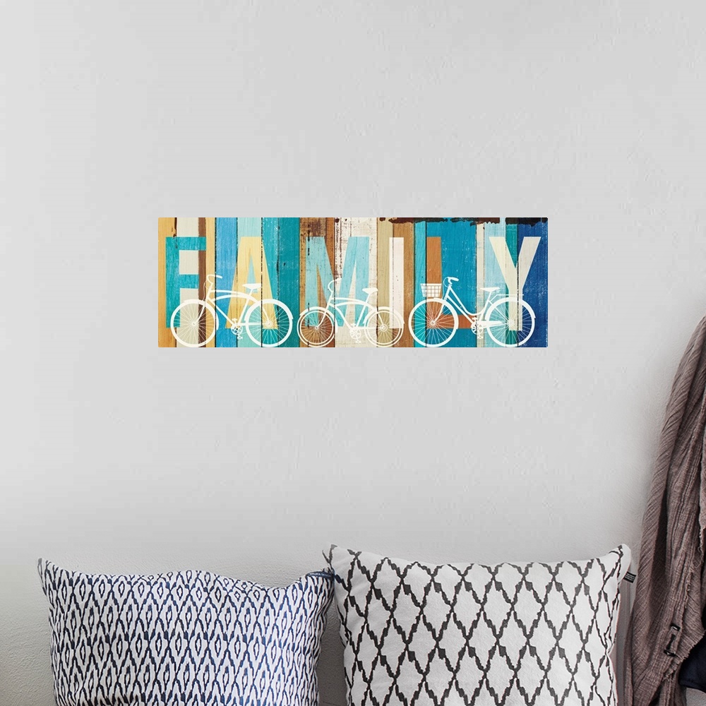A bohemian room featuring "FAMILY" painted on wood panels with white silhouettes of bicycles.