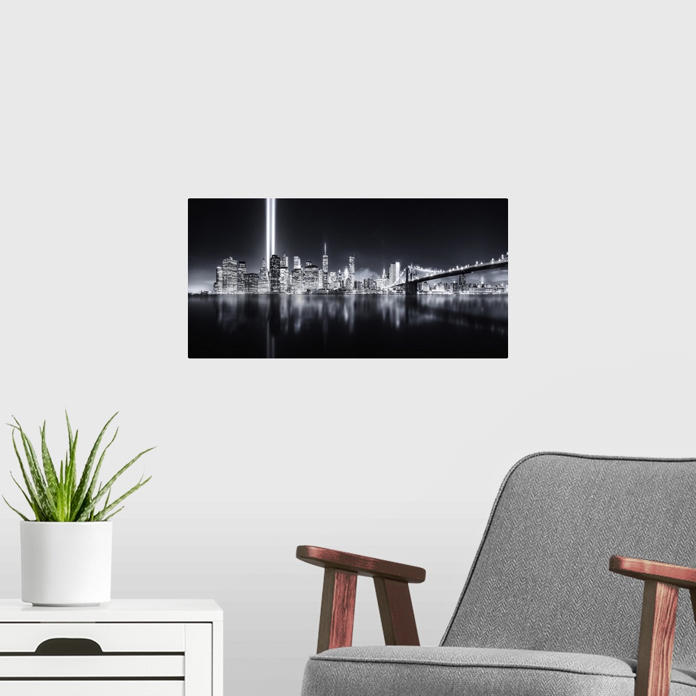 A modern room featuring Columns of light representing the fallen Twin Towers in New York City illuminate the skyline.