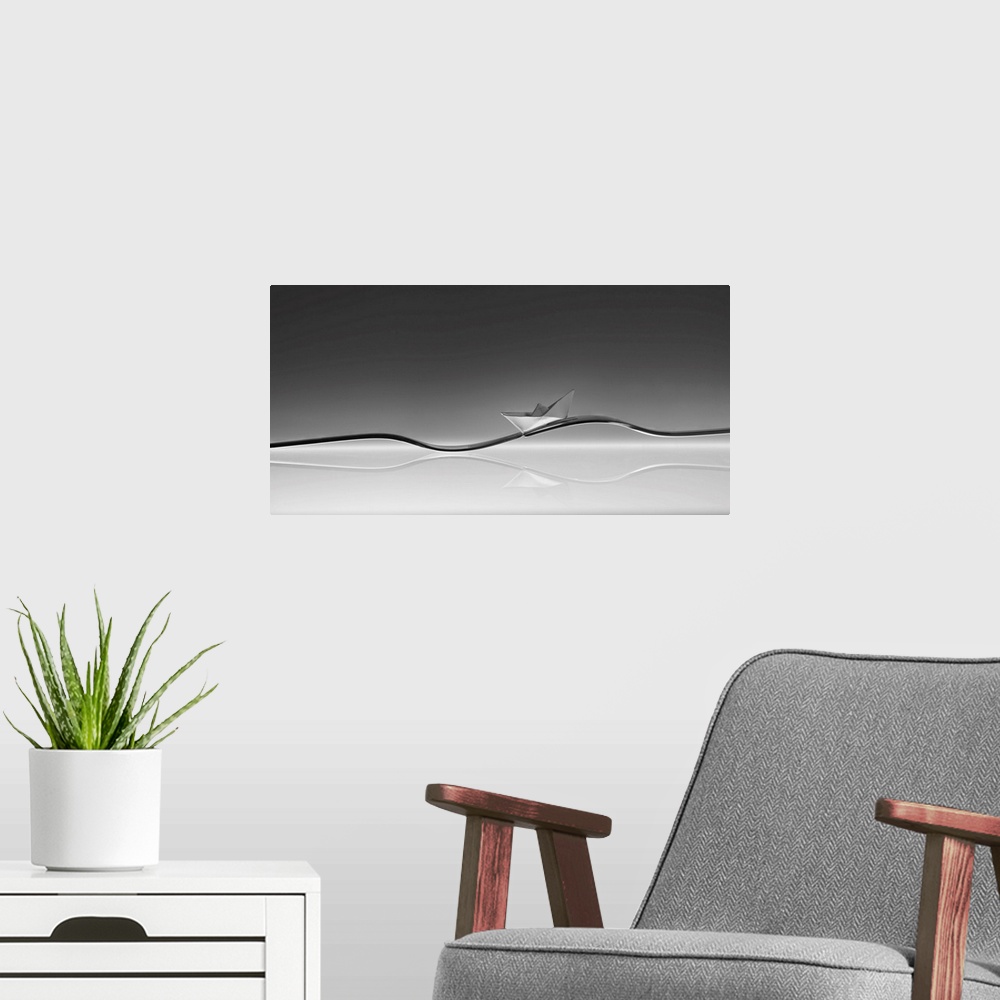 A modern room featuring A small folded paper boat resting on two forks resembling a wave.