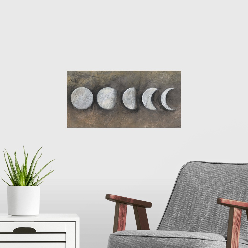 A modern room featuring Contemporary artwork of the moon in five phases.