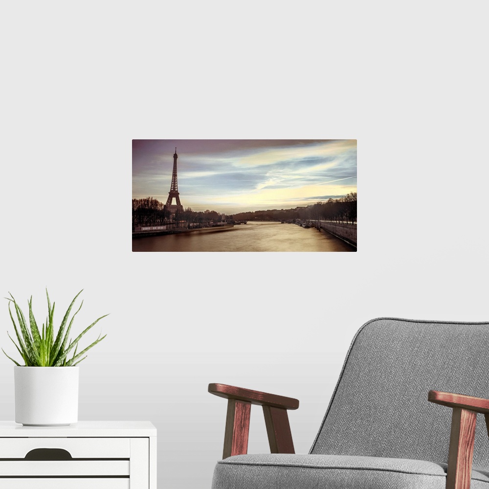 A modern room featuring Panoramic image of Paris with the Eiffel tower and Seine River in the evening.
