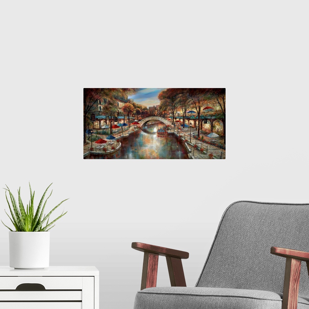 A modern room featuring Contemporary artwork of a city scene in the evening with a canal running through the town.
