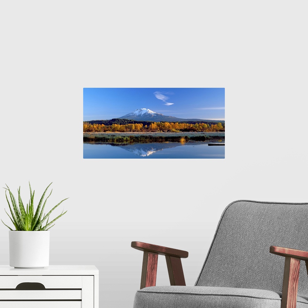 A modern room featuring View of the peak of Mount Adams in Washington, reflected in the water.