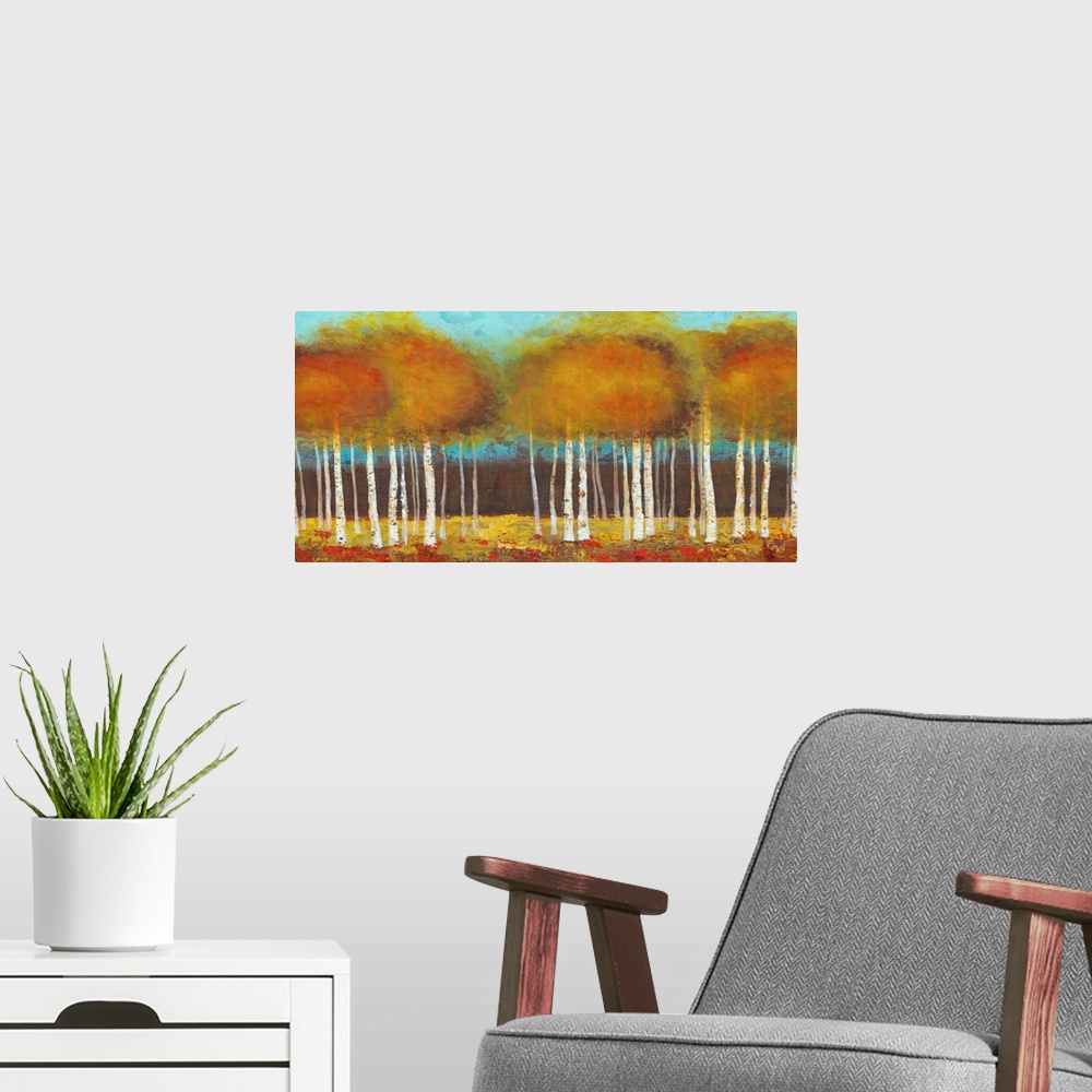 A modern room featuring Contemporary painting of brown and orange trees against a teal background sky.