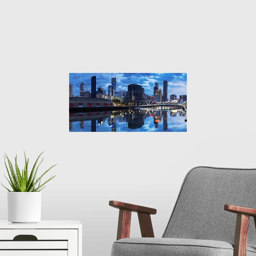 A modern room featuring South Wharf skyline at dawn, Melbourne, Victoria, Australia.
