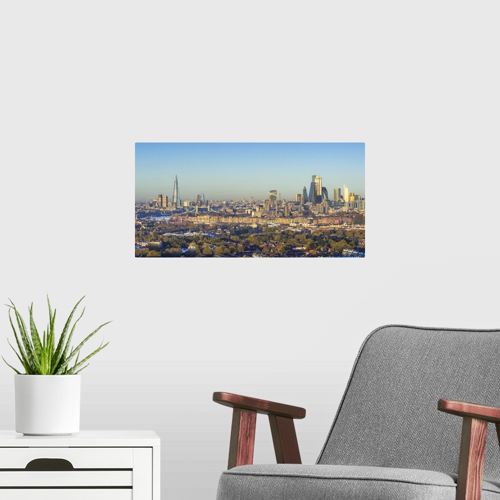 A modern room featuring The Shard & City of London skyline from Canary Wharf, London, England