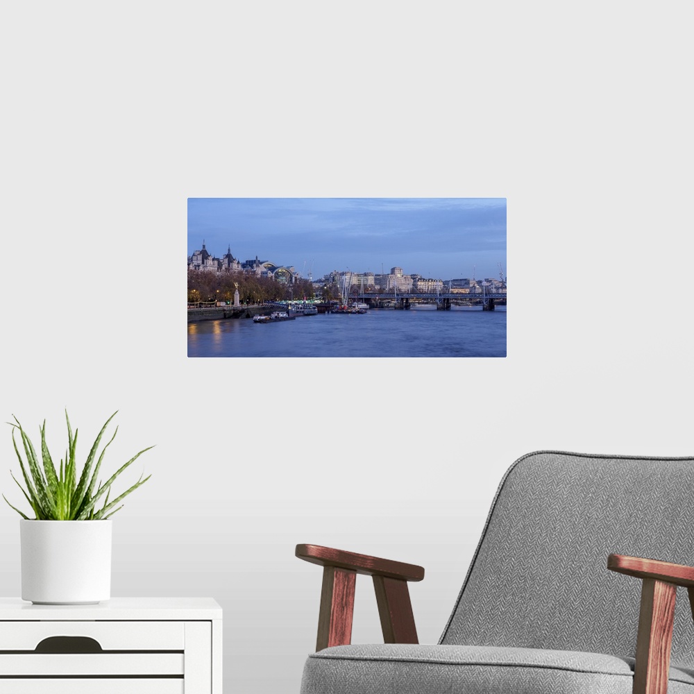 A modern room featuring View over River Thames towards Hungerford Bridge and Charing Cross Station, London, England, Unit...