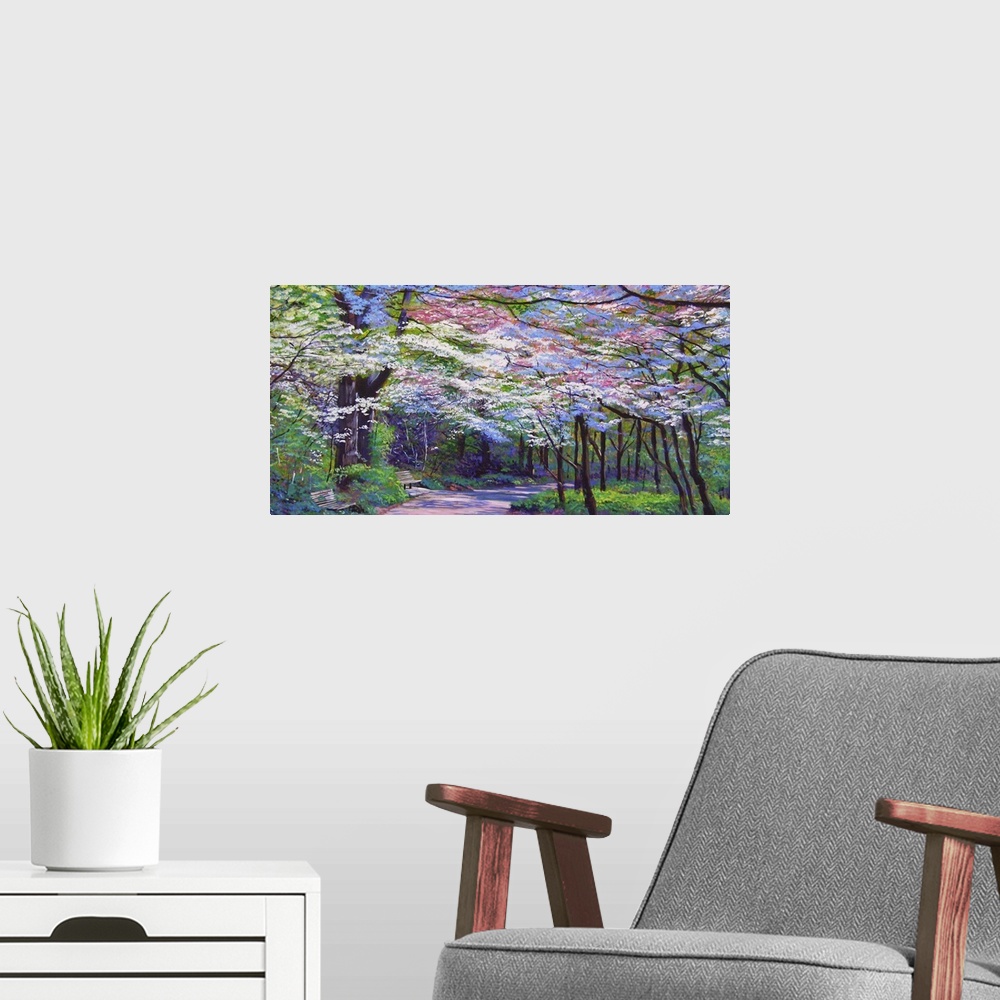 A modern room featuring Painting of a path full of trees in full bloom with white and pink flowers.