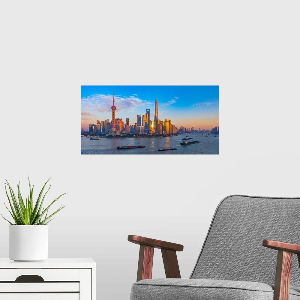 A modern room featuring Panoramic photograph of the city of Shanghai, China.