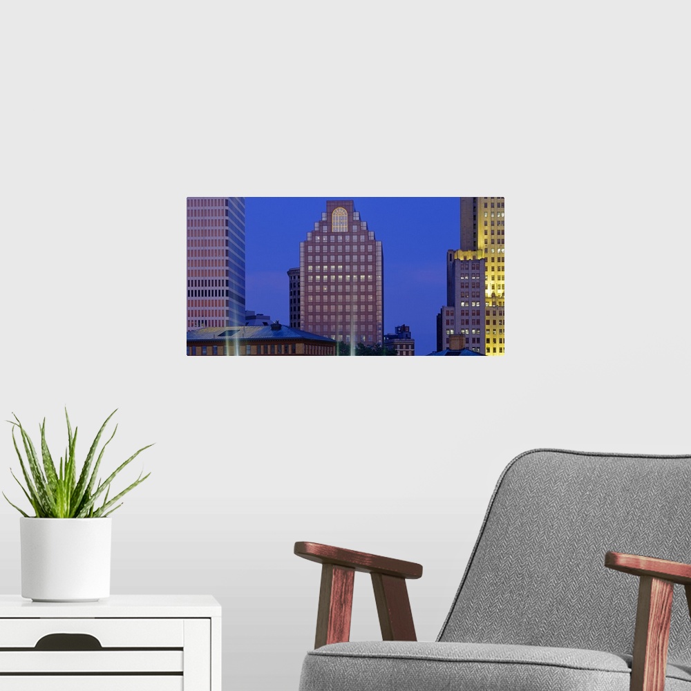A modern room featuring Buildings illuminated at dusk, Providence, Rhode Island