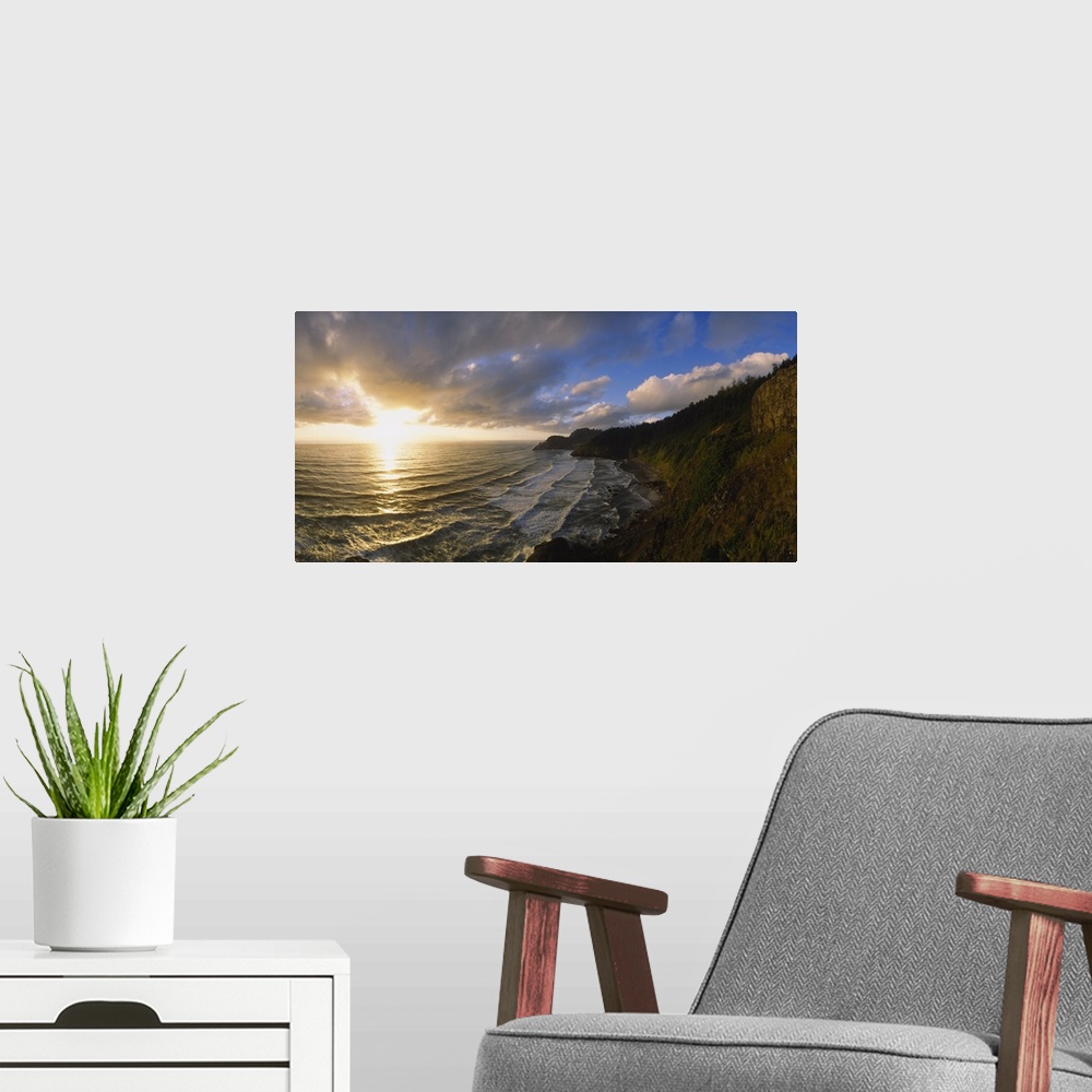 A modern room featuring Photograph of steep shoreline with waves rolling in under a bright cloudy sky at sunrise.