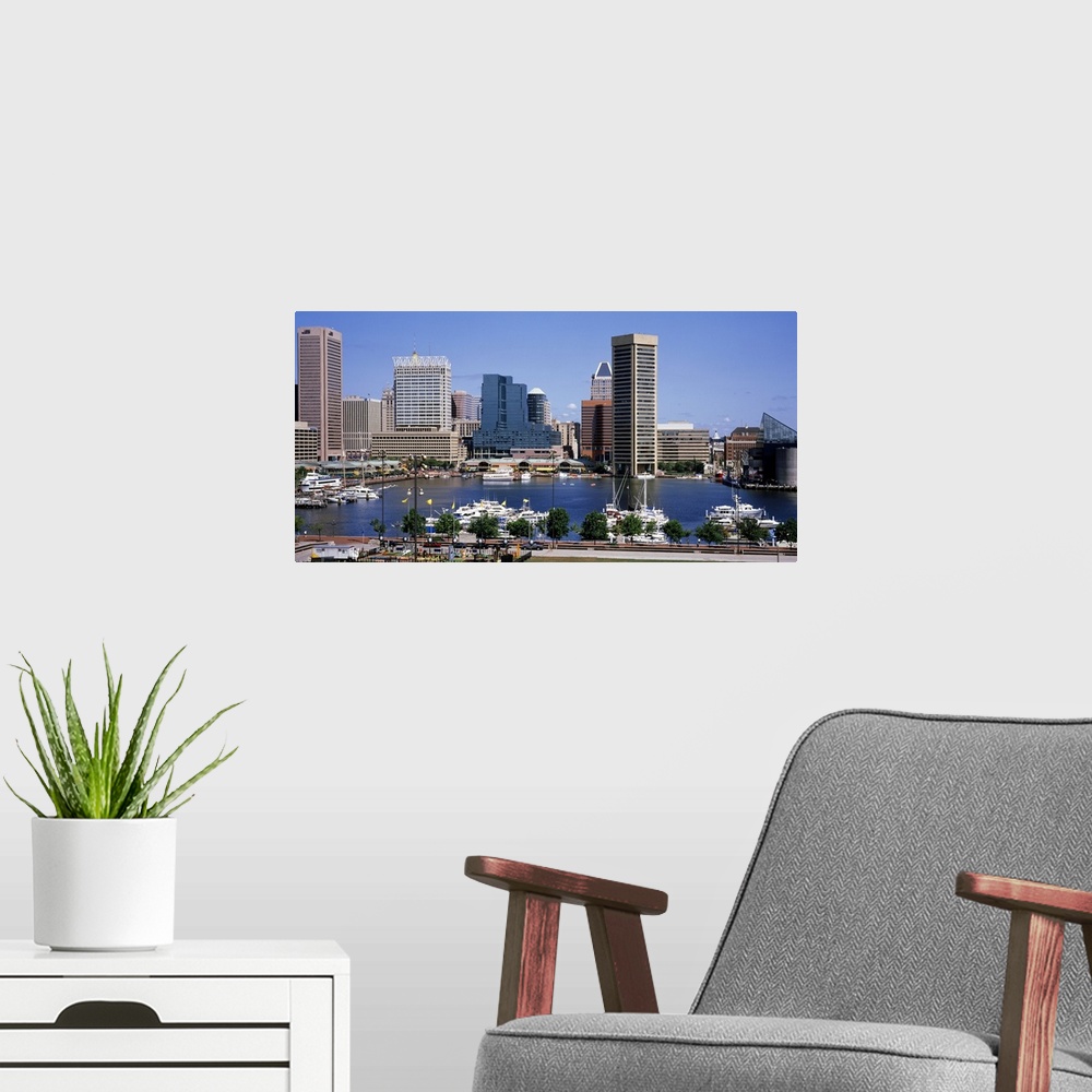 A modern room featuring Image of the inner Baltimore harbor skyline with boats parked in the marina waters.