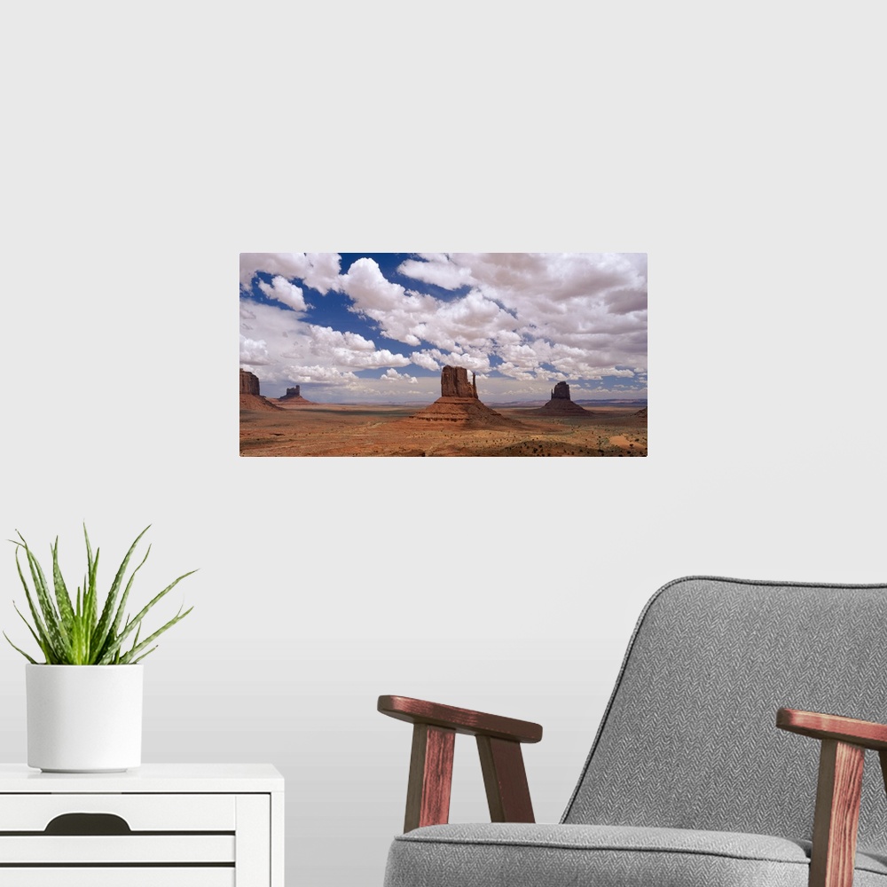 A modern room featuring Horizontal photo on canvas of rock monuments in a desert in Arizona.