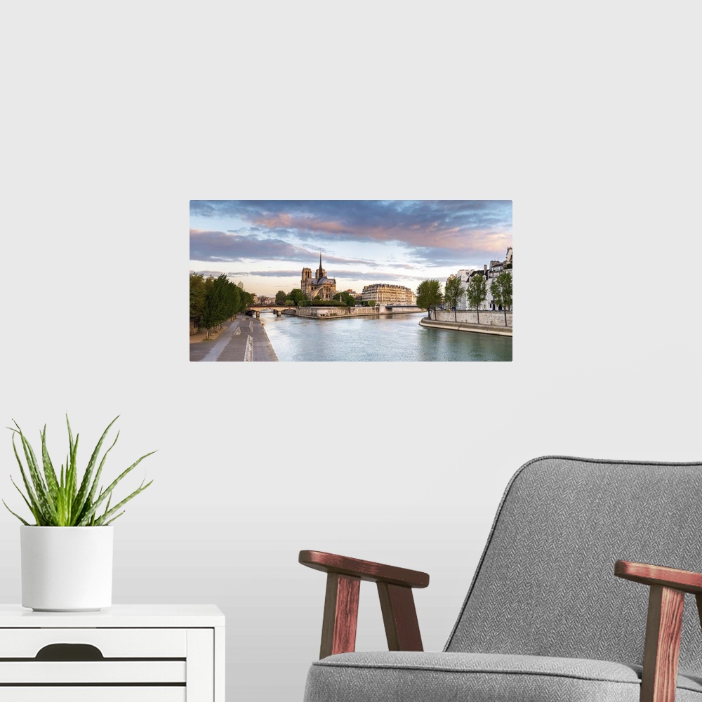 A modern room featuring Notre Dame Cathedral on the banks of the Seine River at sunrise, Paris, Ile-de-France, France