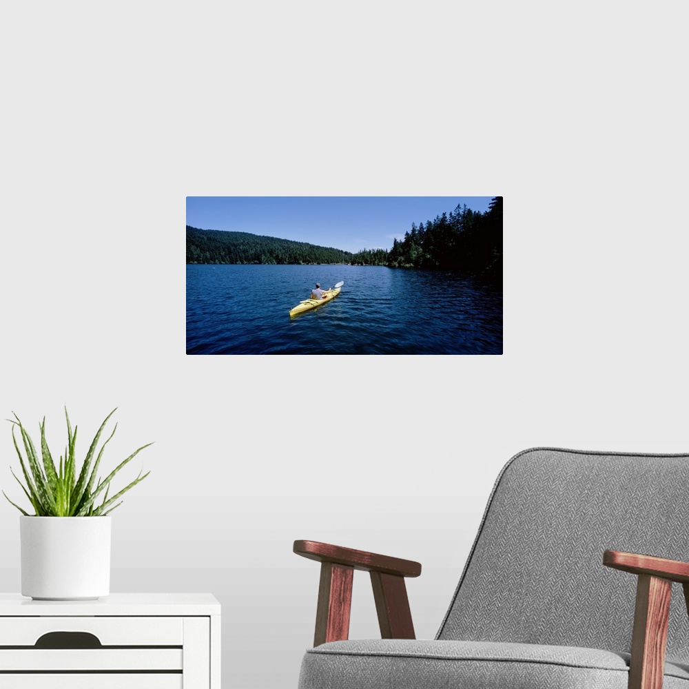 A modern room featuring Rear view of a man on a kayak in a lake, Orcas Island, Washington State