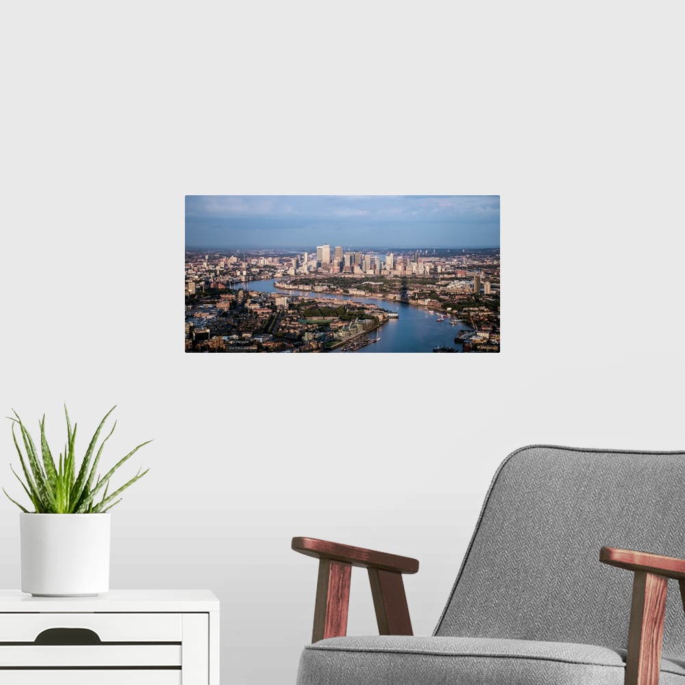 A modern room featuring Aerial view of Canary Wharf and River Thames in London, England.