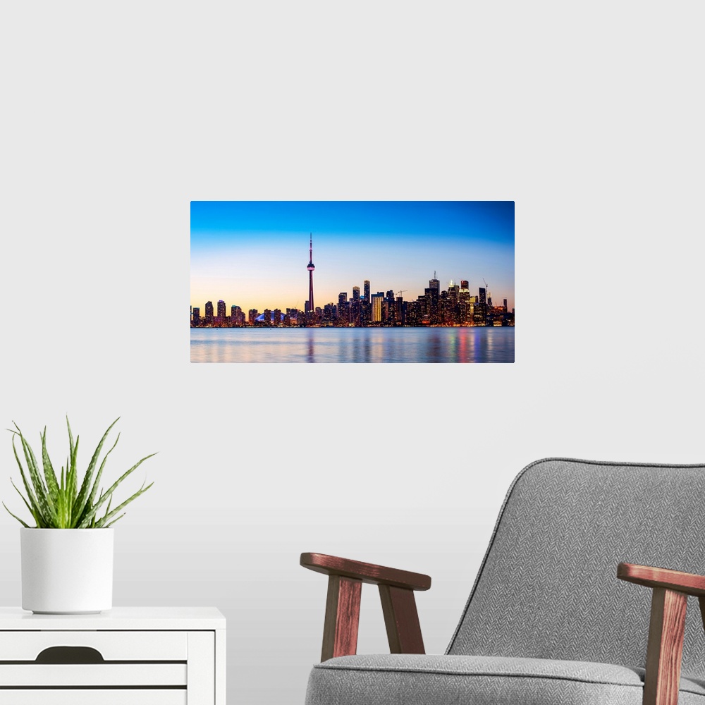 A modern room featuring Photo of Toronto city skyline at sunset, Ontario, Canada.