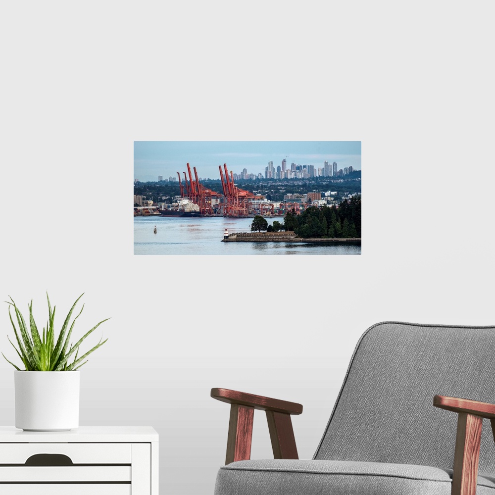 A modern room featuring View of Vancouver harbor with Metrotown in the background, Vancouver, British Columbia, Canada.