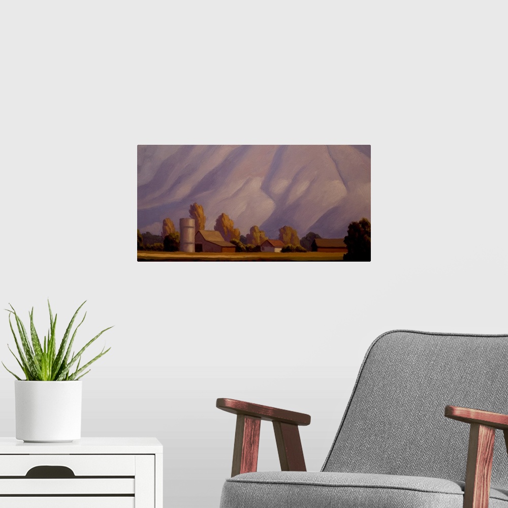 A modern room featuring Landscape painting of a farm with mountains in the background.