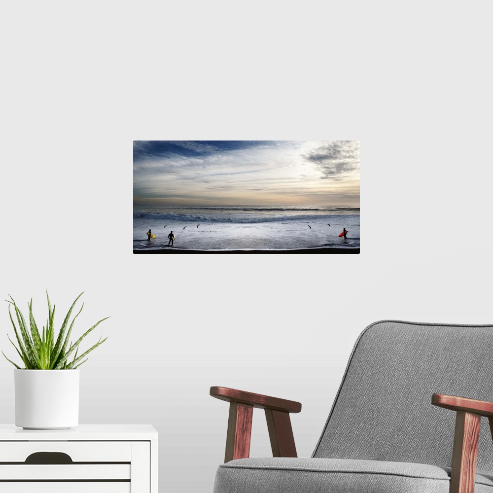 A modern room featuring Surfers in Malibu looking at the waves