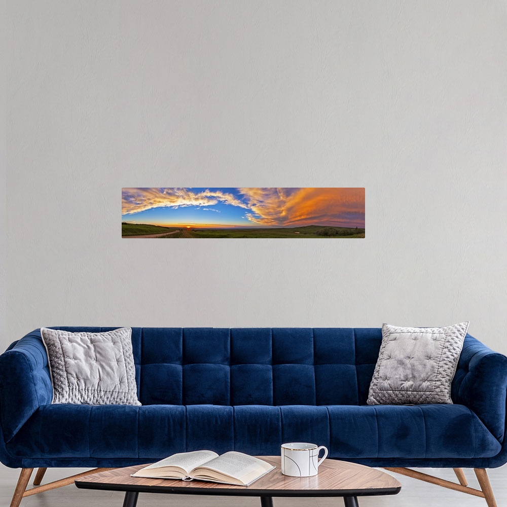 A modern room featuring July 11, 2013 - Panoramic view of sunset at Reesor Ranch, near Cypress Hills, Alberta, Canda.