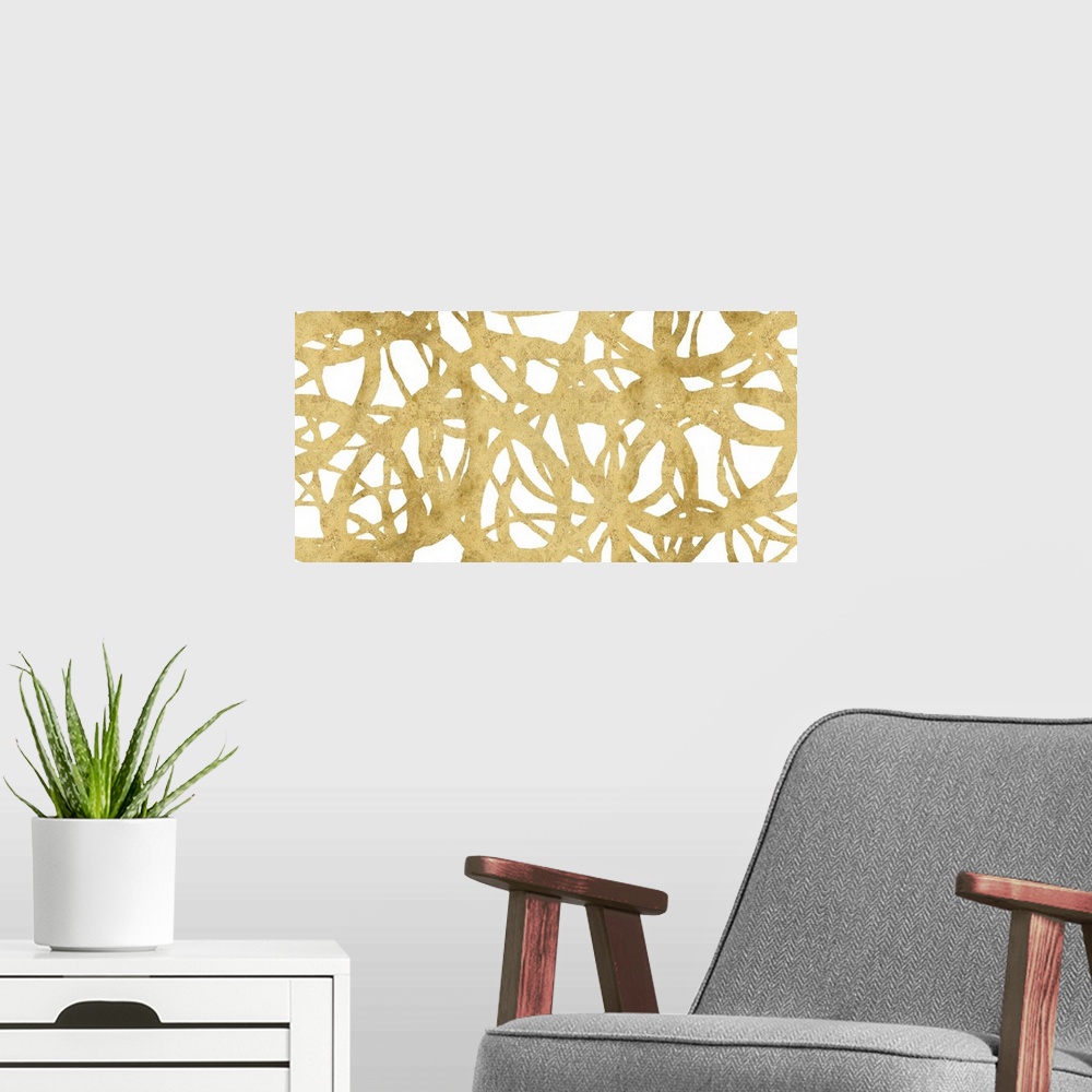 A modern room featuring Large abstract painting with a golden web-like design on a white background.
