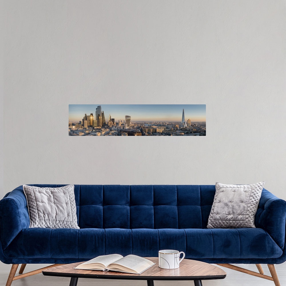 A modern room featuring Panoramic cityscape and skyline of London with The Shard, 20 Fenchurch and various other skyscrap...
