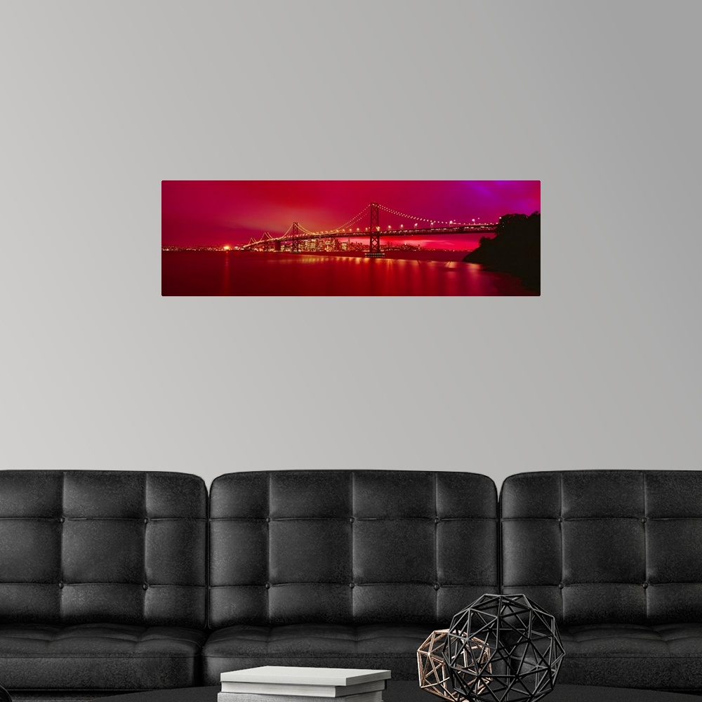 A modern room featuring This panoramic landscape photograph was taken at just time of day to turn the sky a brilliant hot...