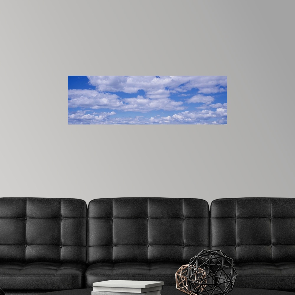 A modern room featuring Cumulus Clouds Blue Sky