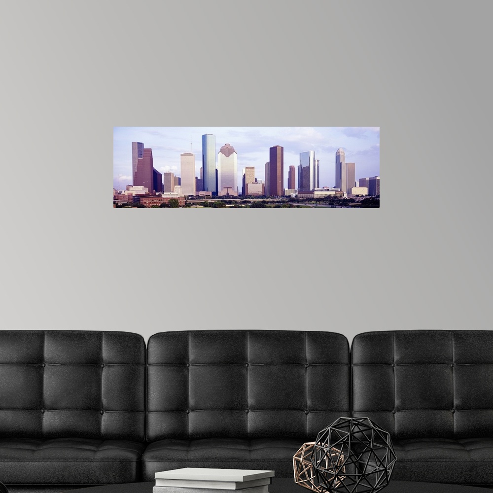 A modern room featuring Panoramic photograph of skyline with park in the foreground.