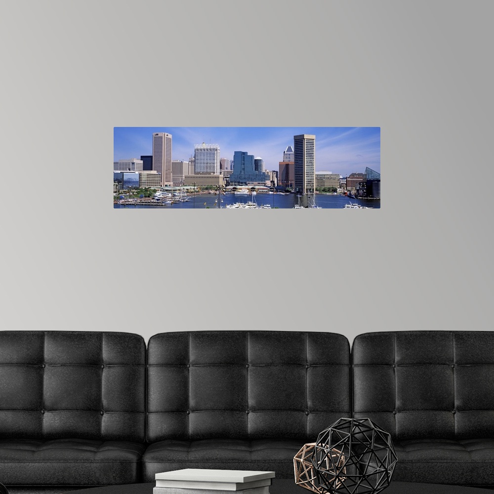 A modern room featuring Panoramic image of the harbor area of downtown Baltimore, Maryland with sailboats and yachts park...