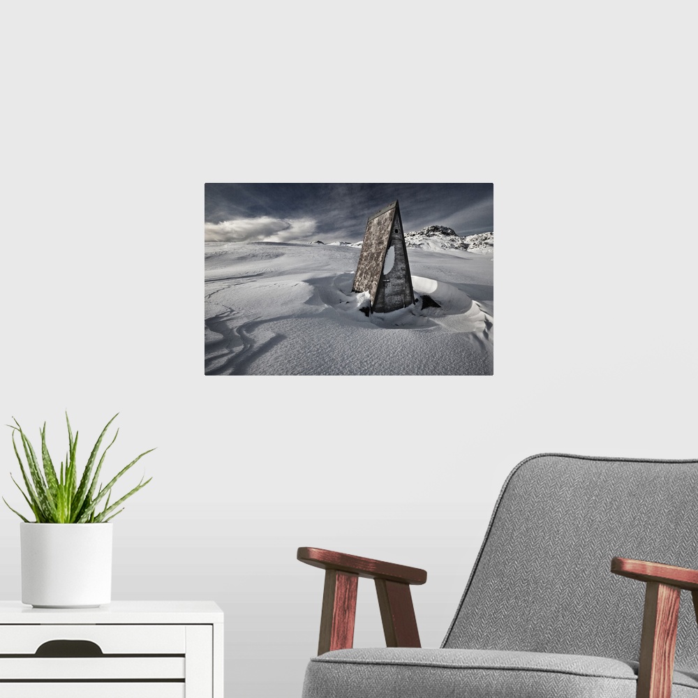 A modern room featuring A triangular shack in the deep snow on the Reykjanes Peninsula, Iceland.